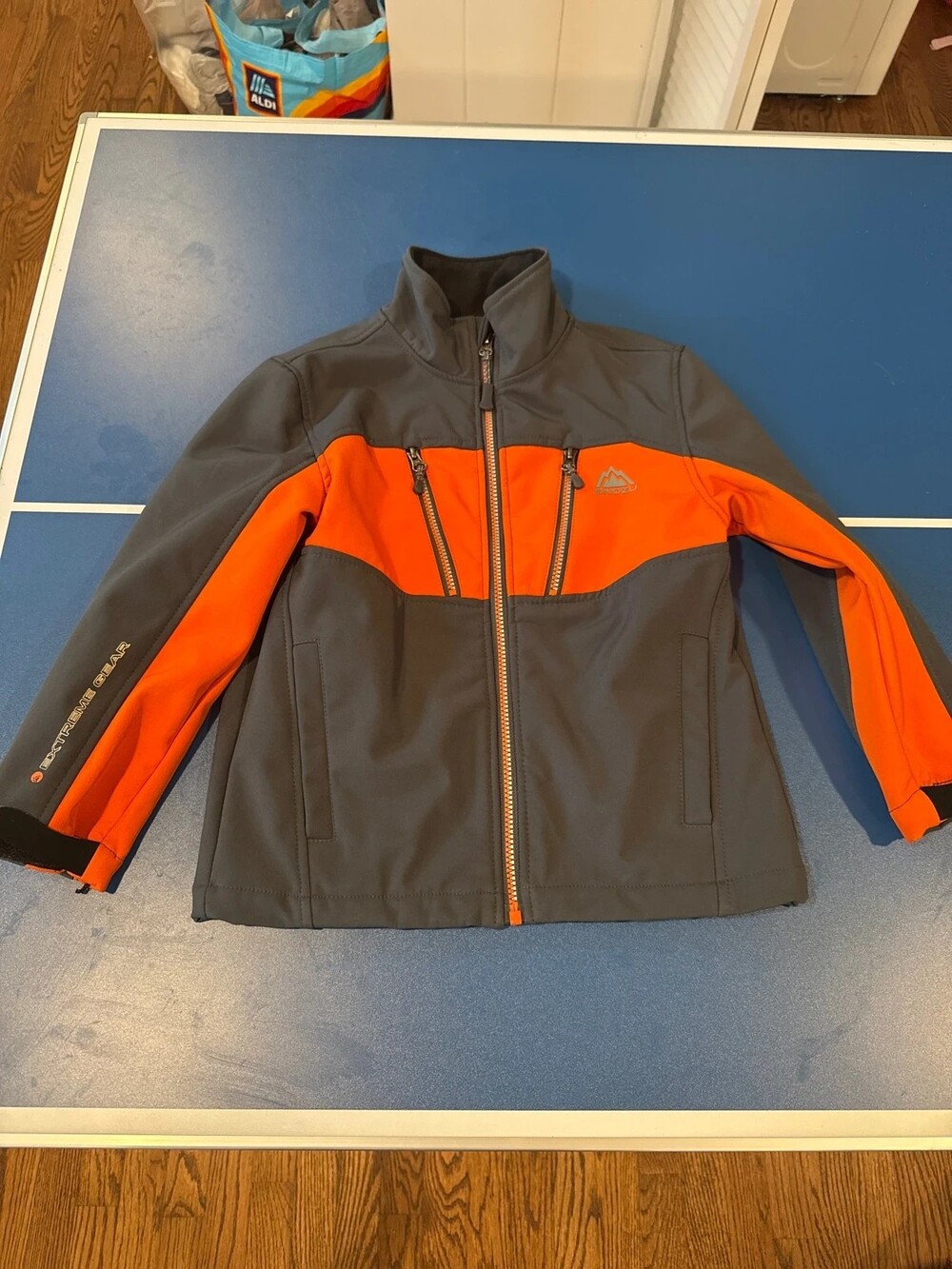 Orange and grey performance jacket by Snozu